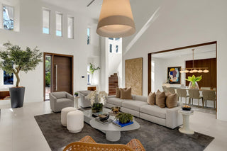 Turnkey Furniture Miami - Modern living room with white sofa, coffee table, and decorative items.